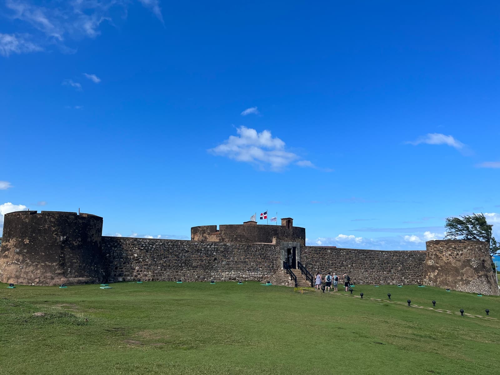 The stone walls of Fortaleza San Felipe on its grassy headland in Puerto Plata