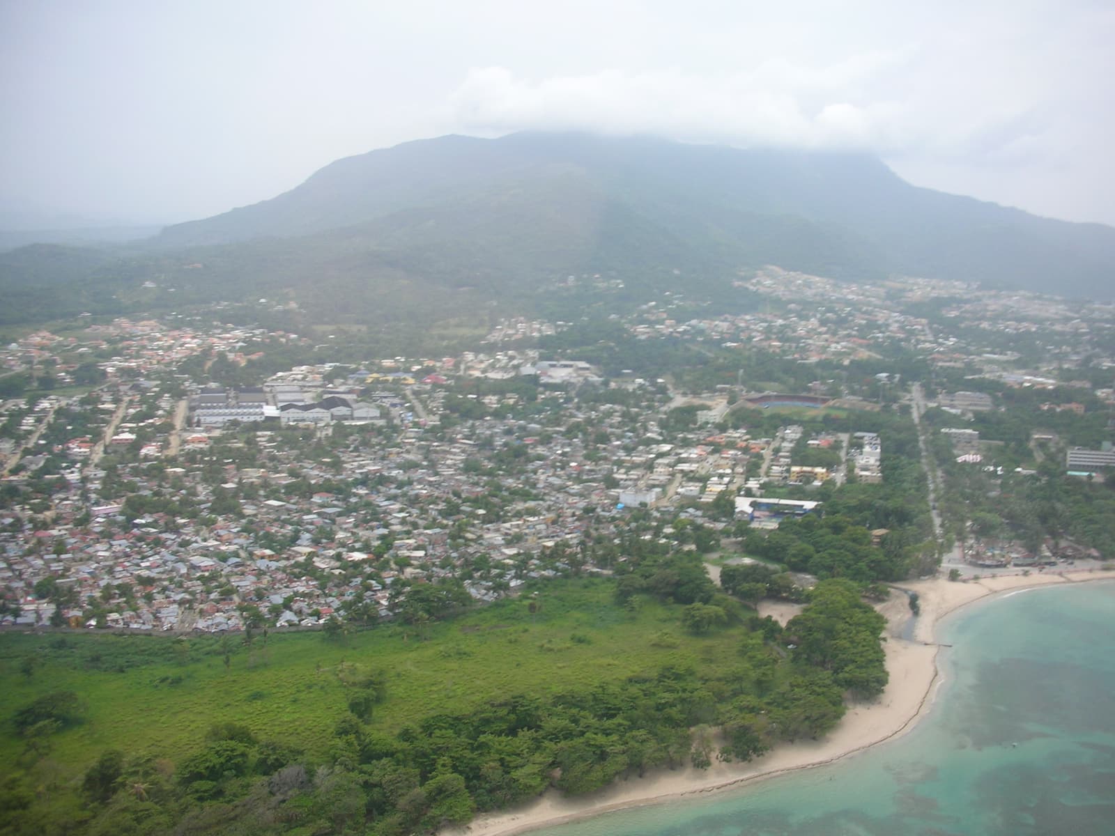 Puerto Plata from the air with Mount Isabel de Torres under cloud